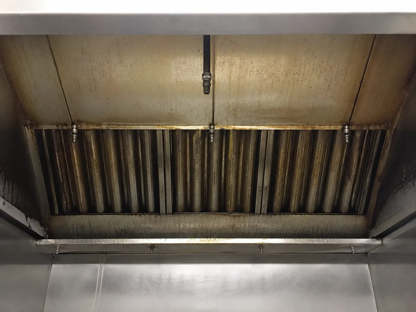 Illustrative hood interior before cleaning